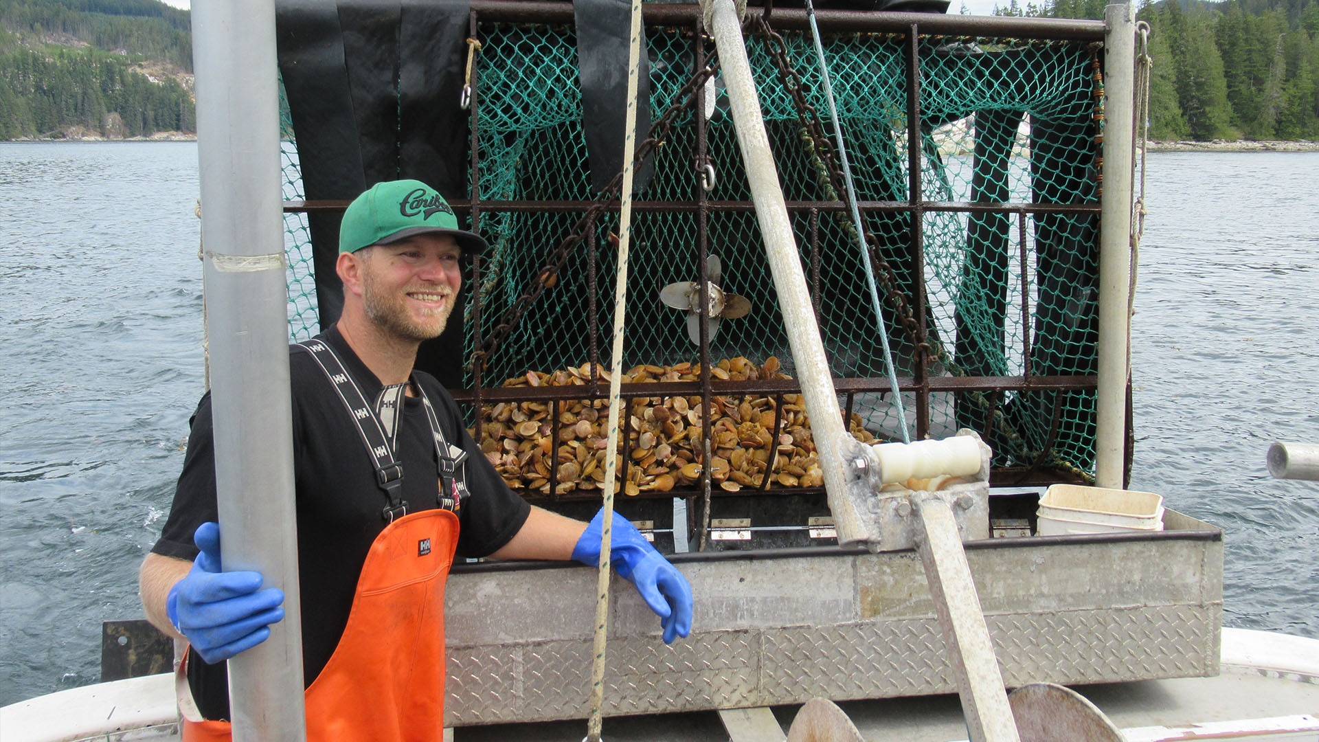 Joel next to freshly caught scallops