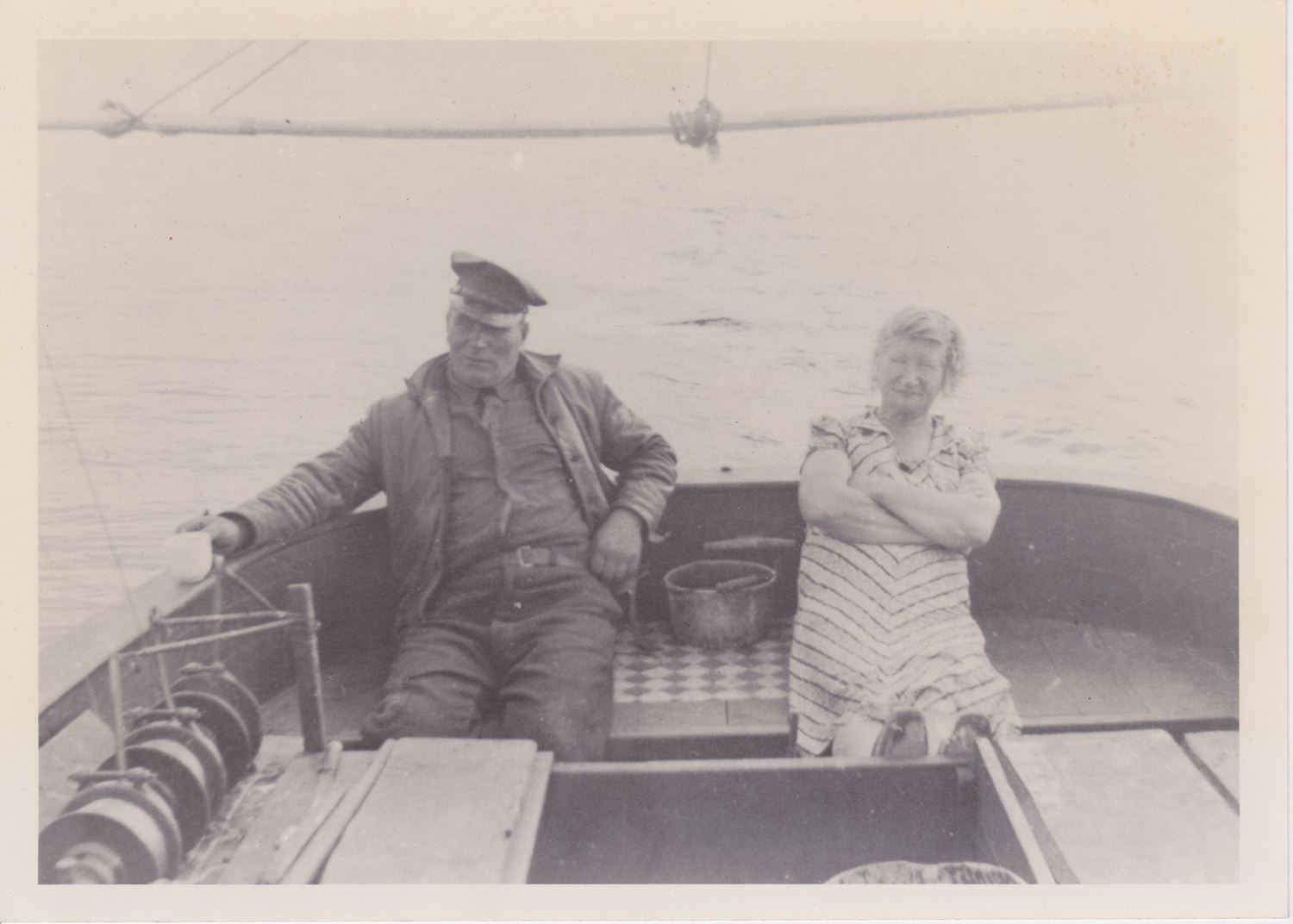 Great grandparents sitting on a boat during a fishing trip